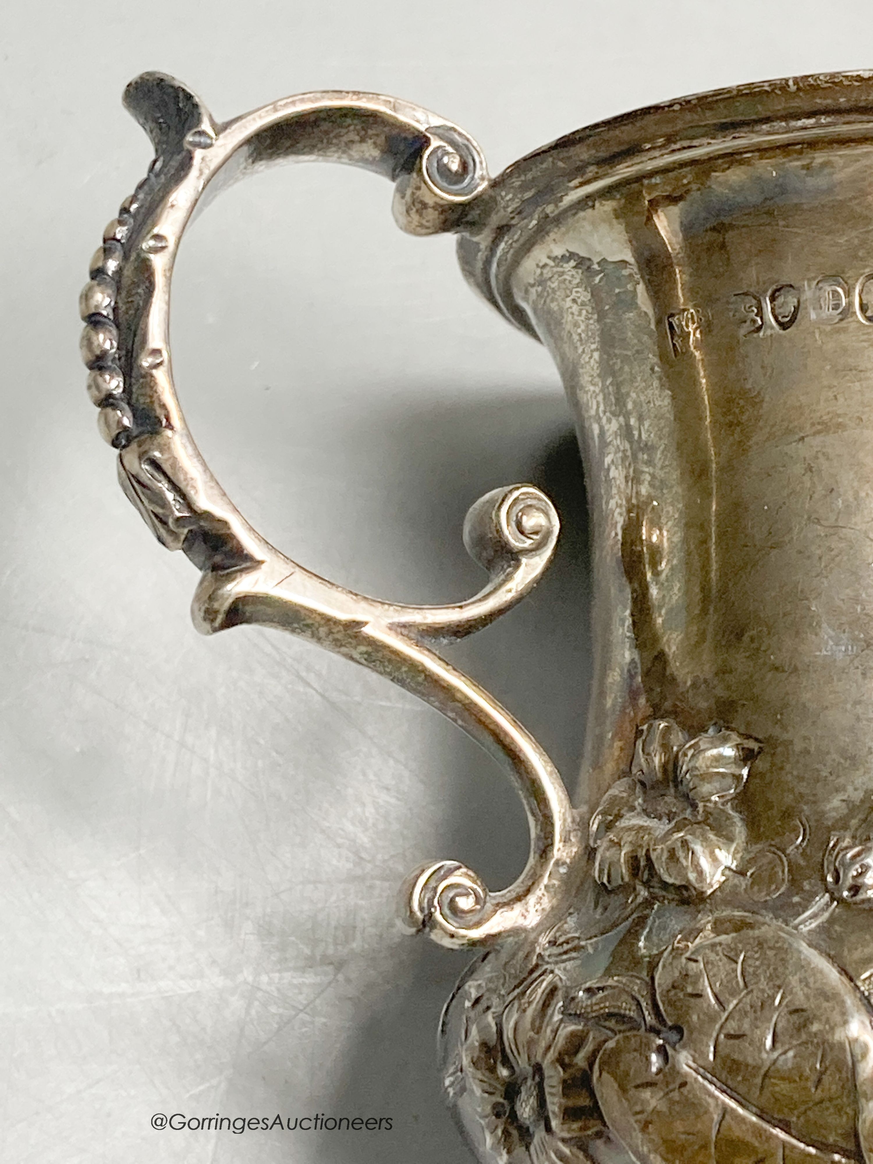 An early Victorian silver vase shaped christening mug, embossed with leaves, Brown & Somersall, London, 1839, 10.8cm, 5oz.